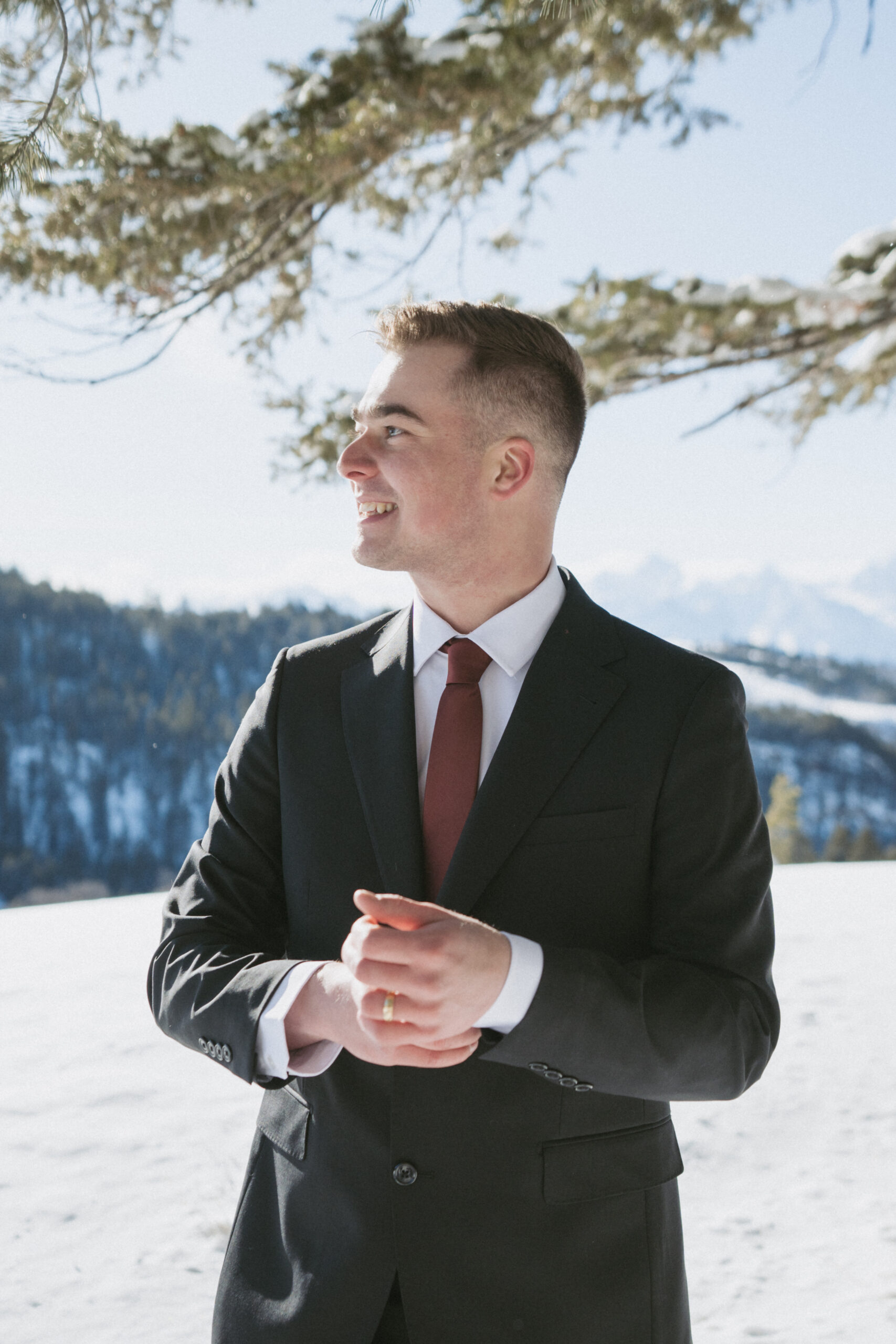 Groom posing for portrait photos in the Grand Teton National Park.